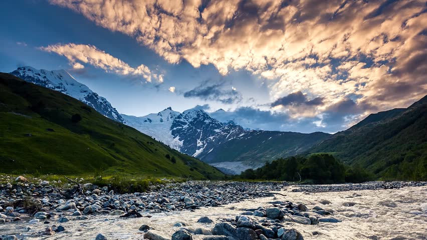 Time lapse clip. River in mountain valley at the foot of Tetnuldi glacier. Upper