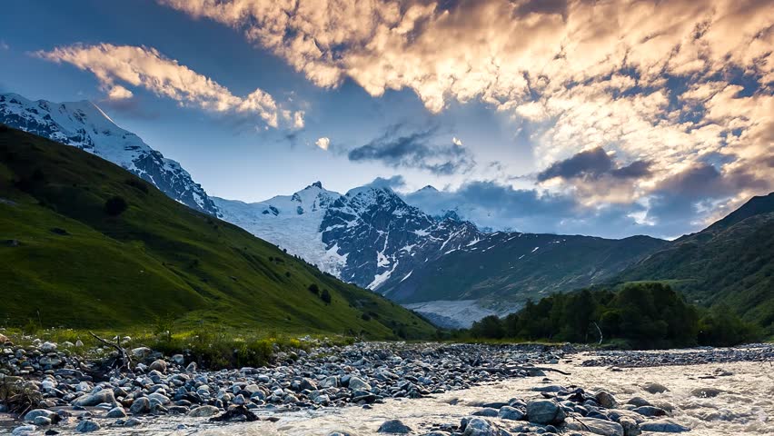 Time lapse clip. River in mountain valley at the foot of Tetnuldi glacier. Upper