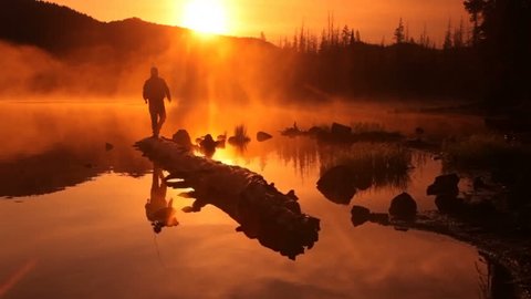 Fisherman at sunrise Stockvideo