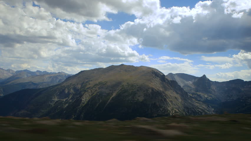 Scenic view from a driving vehicle of mountainous expanse in Rocky Mountain National Park.