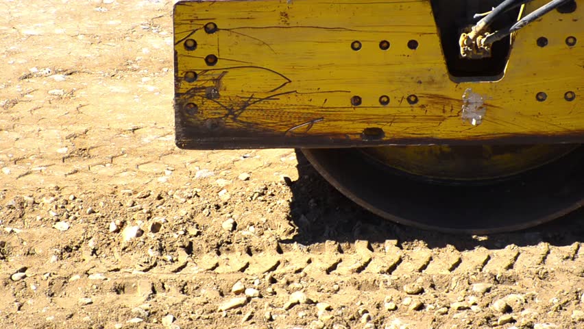 Steam road roller leveling for fresh asphalt pavement - Stock Video. A roller