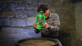 Elderly man sitting in basement by the barrel and lighting an old oil lamp.
 - Powered by Shutterstock - Get 15% off with code: PIKWIZARD15