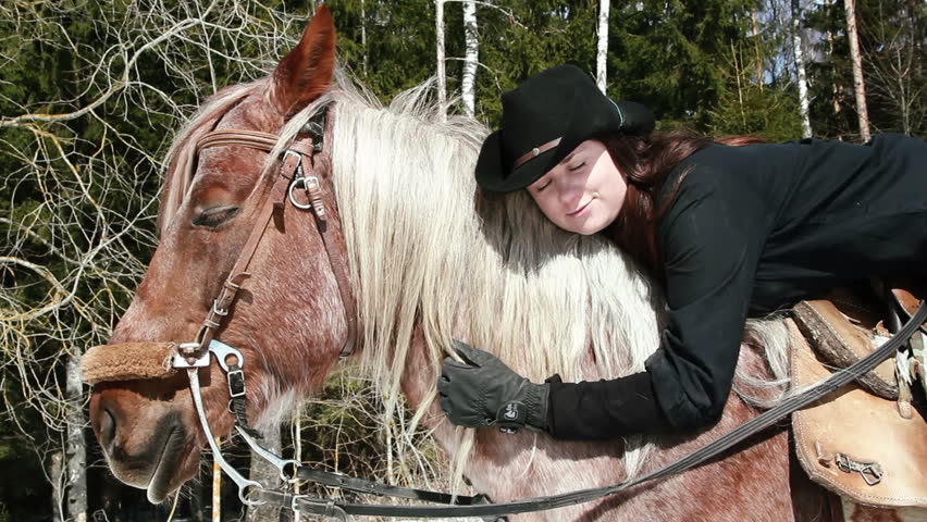 girl cowboy sitting on a horse