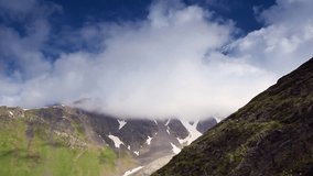 Alpine meadows with dramatic sky at the foot of  Mt. Ushba. Upper Svaneti, Georgia, Europe. Caucasus mountains. Beauty world. HD video clip (High Definition)