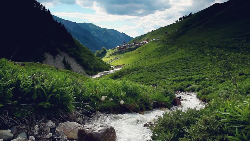 River in mountain valley at the foot of Tetnuldi glacier. Upper Svaneti,