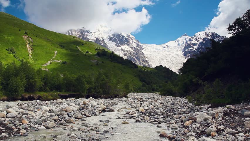 River in mountain valley at the foot of Tetnuldi glacier. Upper Svaneti,