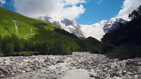 River in mountain valley at the foot of Tetnuldi glacier. Upper Svaneti, Georgia, Europe. Caucasus mountains. Beauty world. HD video clip (High Definition).