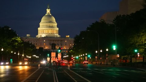 Timelapse shot of United States Capitol building night view from from Pennsylvania Avenue with car lights, Washington DC