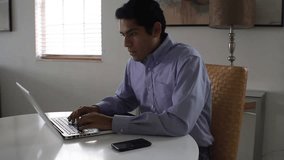 multitasking businessman. computer tablet and phone.