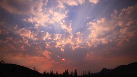 EPIC SMOKEY TIME-LAPSE SUNSET IN A BIG ORANGE AND BLUE SKY

A powerful orange and blue sunset with dancing clouds fill a magnificent cloudy sky above a forested hill. 
Contact us for variable speeds.