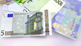 50 Percent Off. Euro paper notes passing in front of camera. Perfect for any financial, commerce, treasury or banking video needs. 
