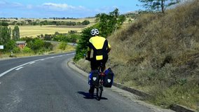 HD: Bicycle Traveler Downhill Cycling - Stock Video. HD1080: Road biker traveler, cycling downhill on the public road