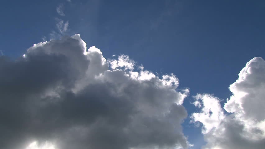 Time lapse of cloudscape with bright sun shining and revealing itself behind clouds. Royalty-Free Stock Footage #4751225