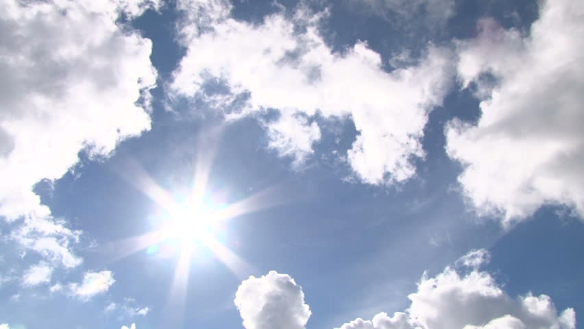 Time lapse of cloudscape with bright sun shining with clouds passing.