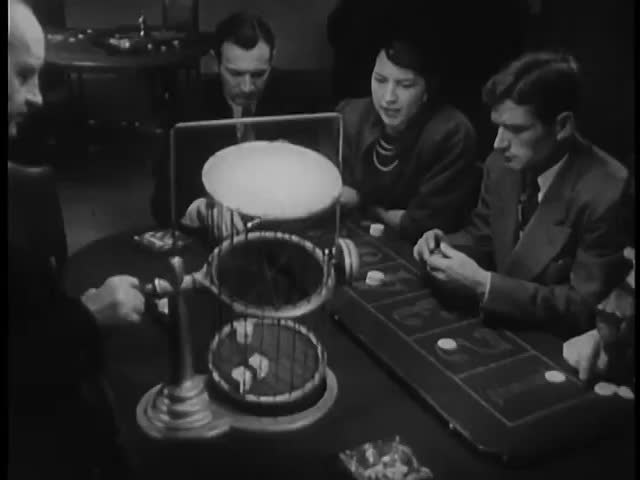 Men and women playing chuck-a-luck in casino