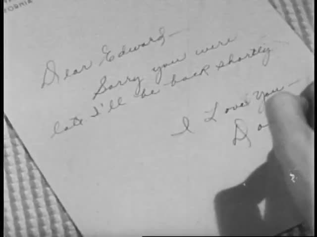 Close-up of woman writing note