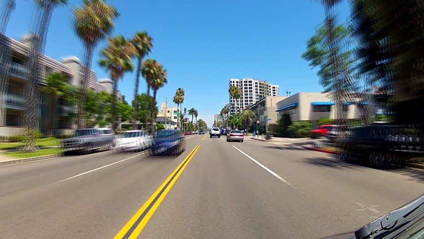 A fast motion, time-lapse point of view shot of a vehicle driving on Ocean