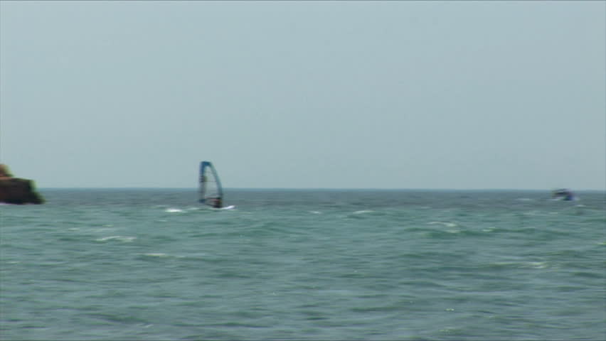 Sailboard in a sea bay