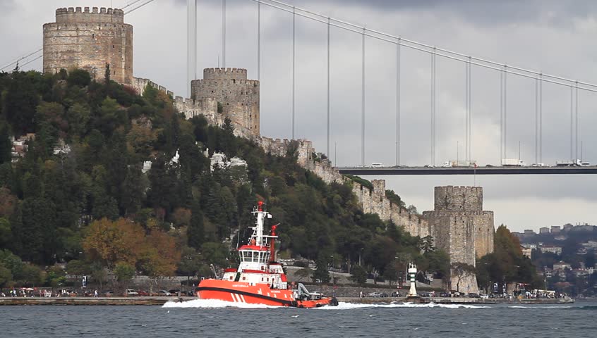 Pilotage service boat sailing past Rumelihisari fort in Straits Bosporus
