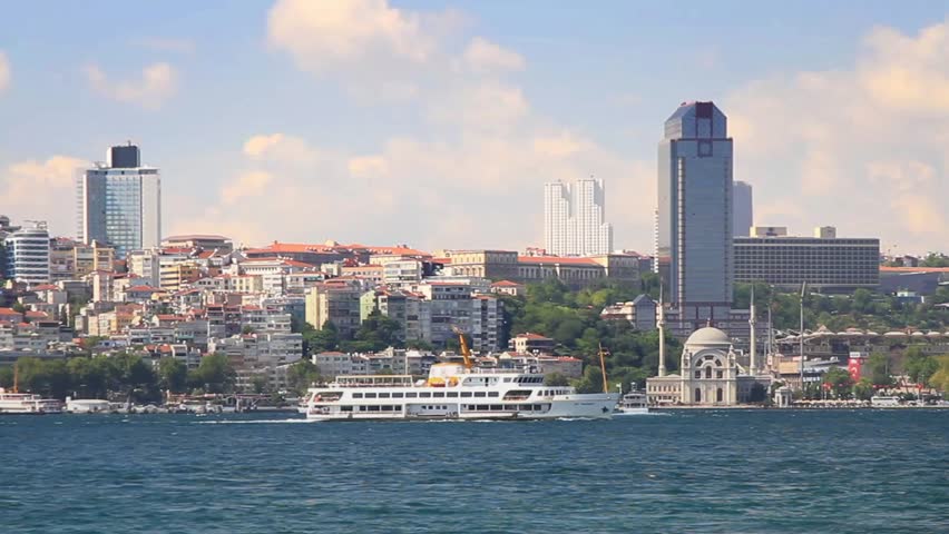 Besiktas region from the waterside. Valide Sultan Mosque and tall hotel