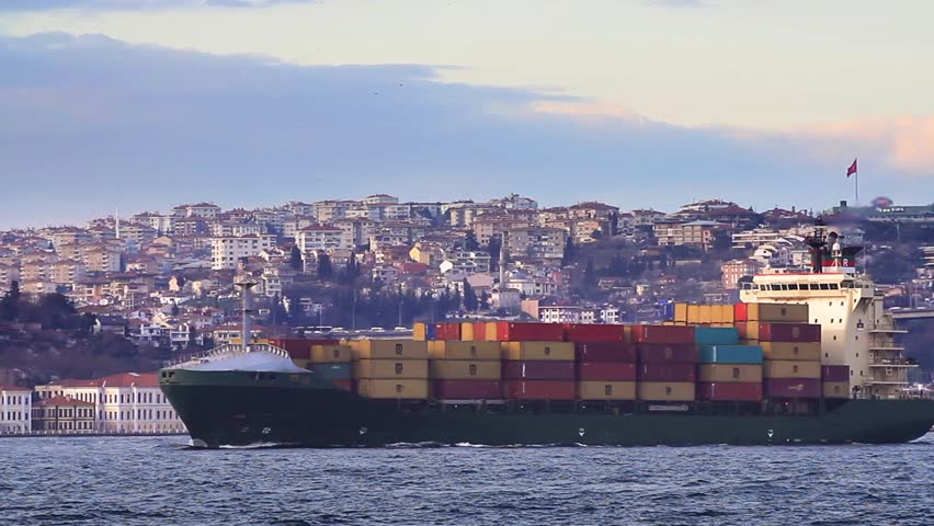 Container Transportation. Cargo ship full of containers sailing in Bosphorus