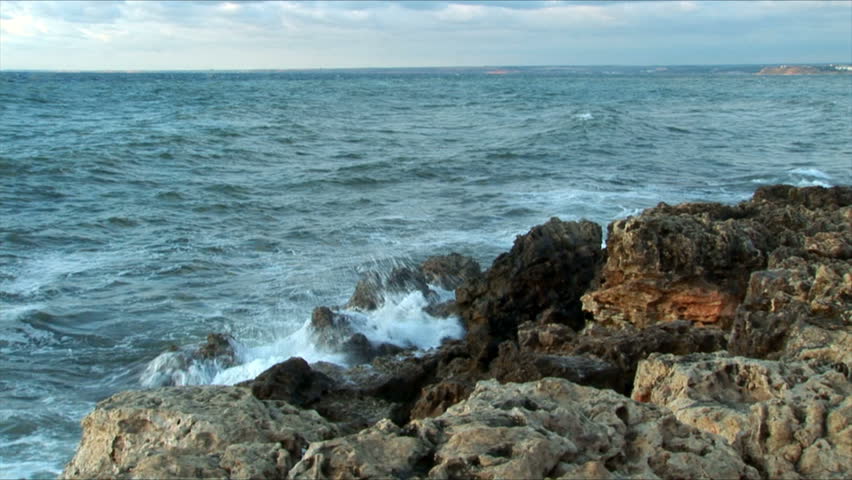 Waves fight about rocks in Black sea for a background
