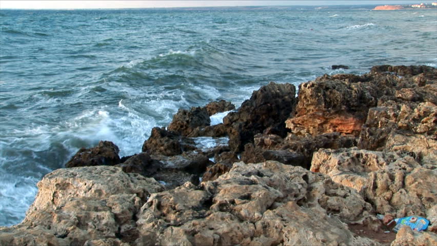 Waves fight about rocks in Black sea for a background