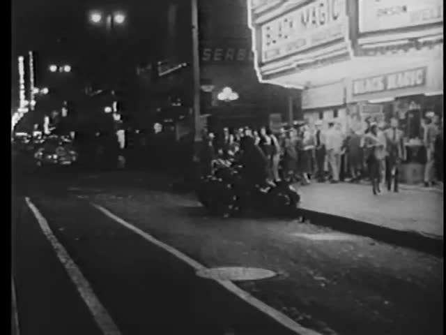 Point of view shot of motorcycle police in front of theater