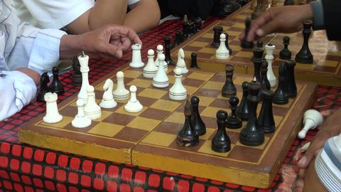 OSH, KYRGYZSTAN - 30 JUNE 2013: Playing a game of chess in a park in Osh