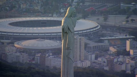 Closeup aerial view of Christ the Redemeer Statue and Maracana Stadium, Rio de Janeiro, Brazil