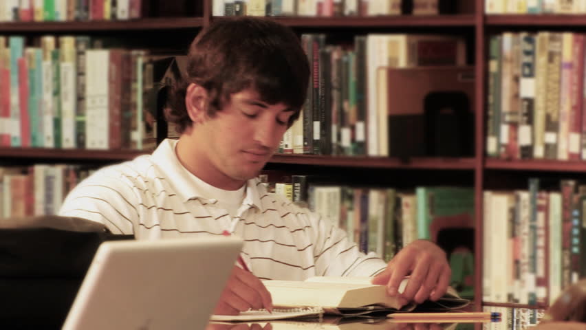 A student studies in the library.