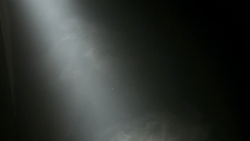 Mysterious Beam Of White Foggy Light With Small Dust Particles On Black