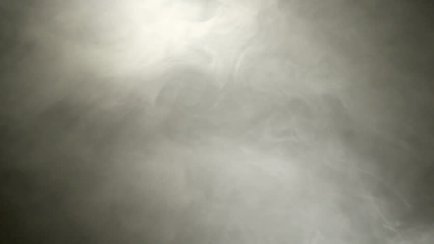 Transparent White Smoke Fills In The Black Background.