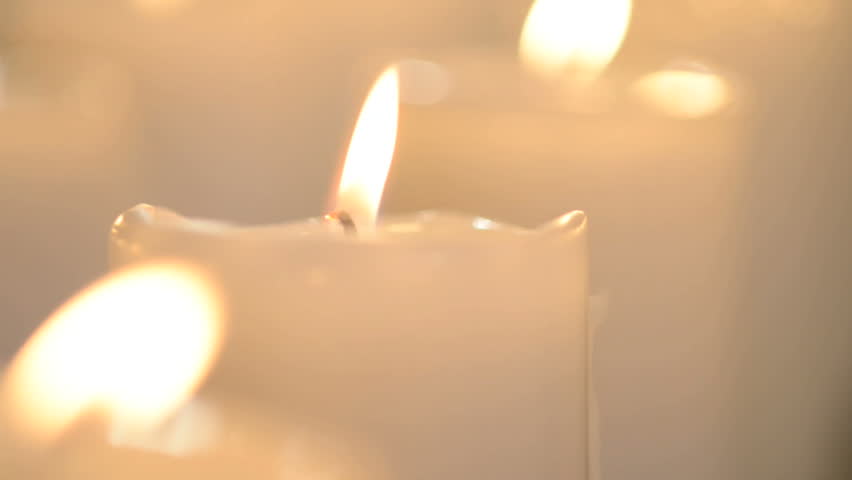 Edited Shot Of A White Candle And Multiple White Candles Burning With Soft
