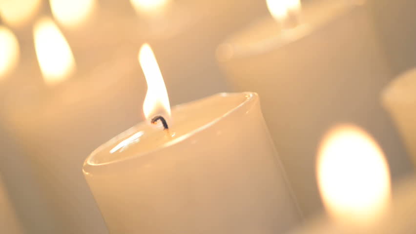Close Shot Of A White Candle Burning With Bright Flame. 
