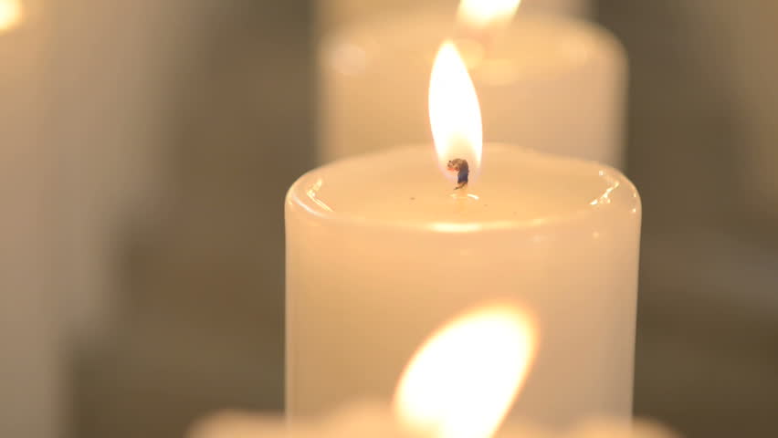 Peaceful Shot Of A Single White Candle Burning With Soft Candle Light. Edited. 