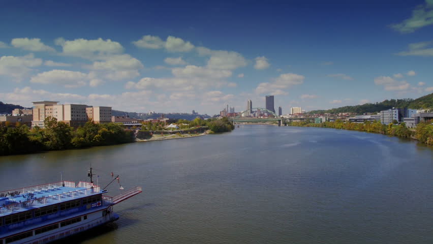A large riverboat heads downriver towards Pittsburgh, Pennsylvania.