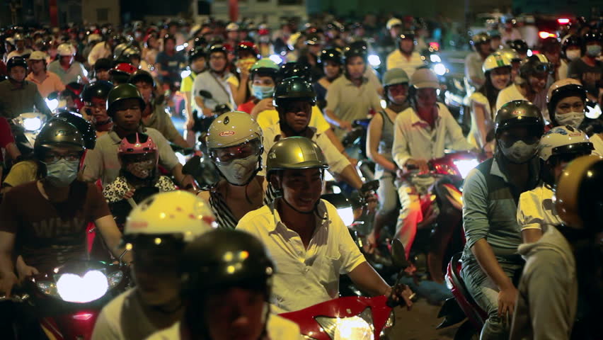 HO CHI MINH CITY - SEPTEMBER 2: Vietnamese people are riding bikes on busy