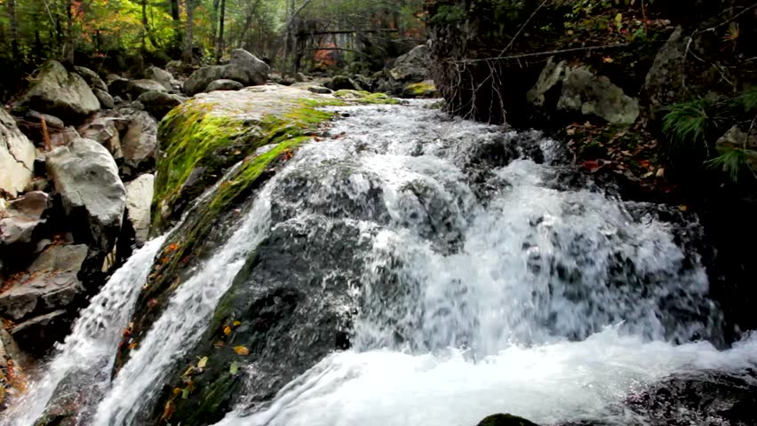 Pure fresh water waterfall in autumn forest