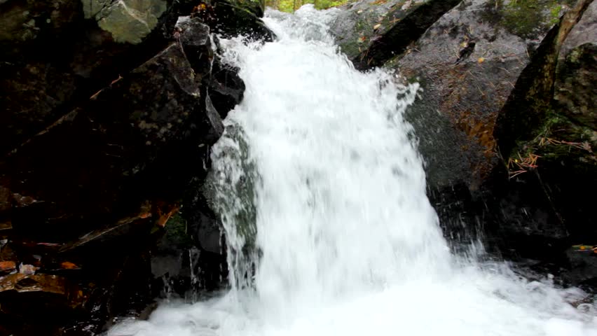 Pure fresh water waterfall in autumn forest