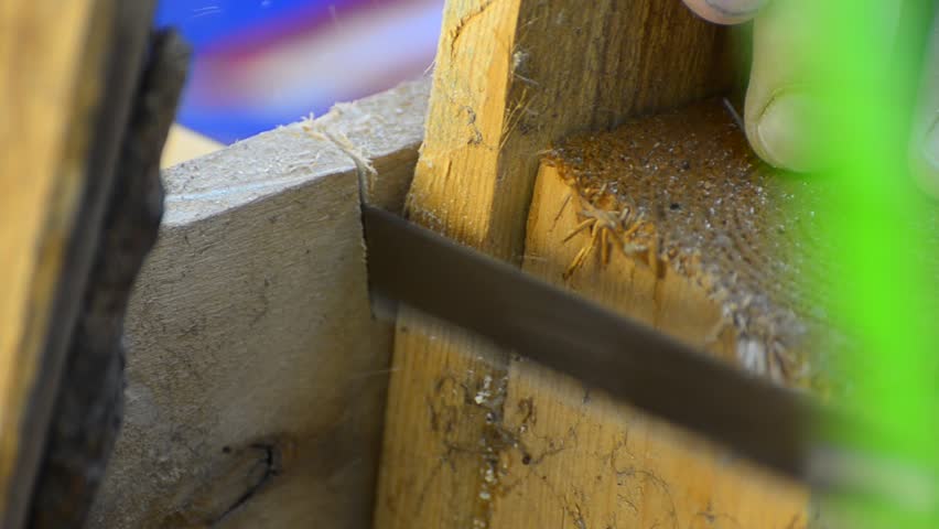 HD: Carpenter Sawing the Wood - Stock Video close up.HD1080p: Close up view of a