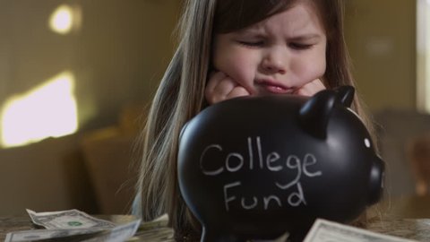 Girl saving money for college fund