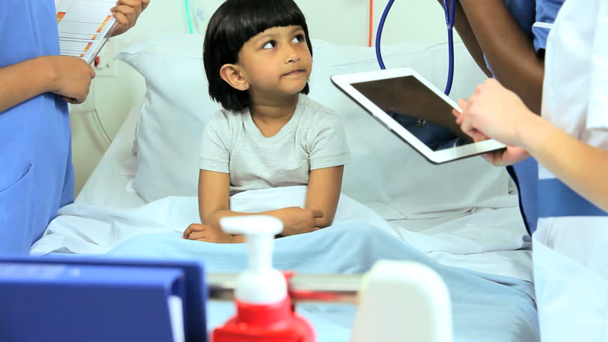 pediatric nurses recording patient's recovery process Stock Footage ...