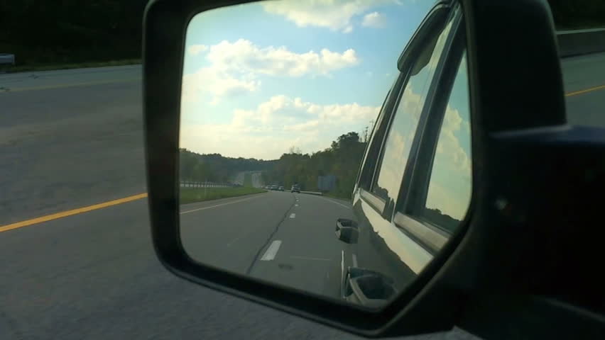 Looking at a rear view mirror on a traveling vehicle.  Shot at 120fps.