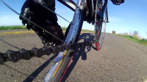Bicycle Road Cyclist cool low angle POV point of view  of chain sprocket peddling on country road HD high definition stock video footage 1080 1920x1080