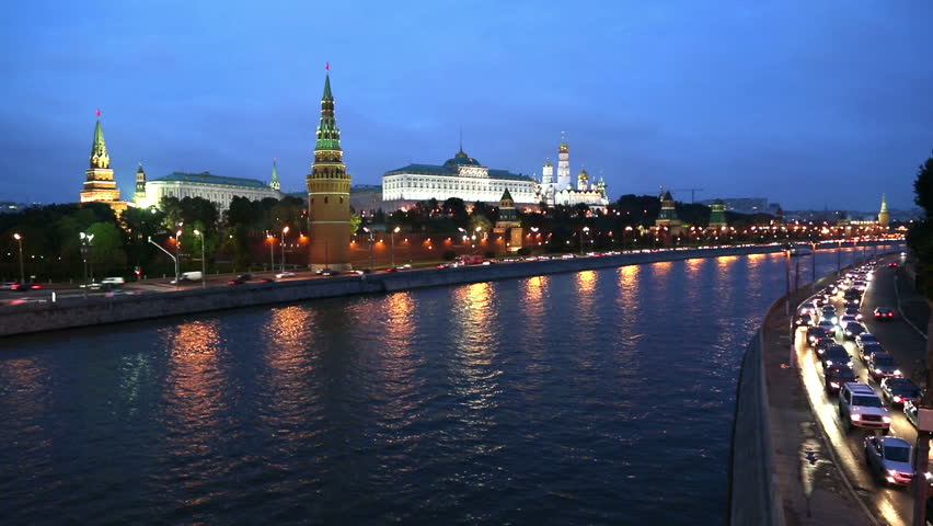 Moscow Kremlin and ships on river - from day to night timelapse