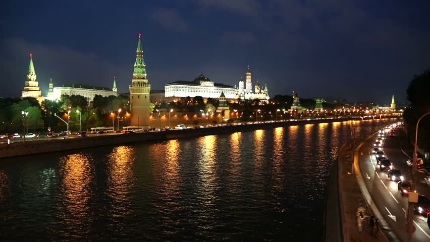 Moscow Kremlin and ships on river at night - timelapse