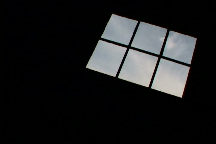 Time Lapse of clouds looking through house window.