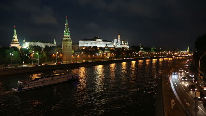 Moscow Kremlin and ship on river at night - Russia