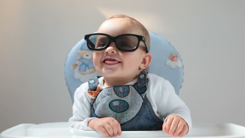 Baby plays with 3D glasses